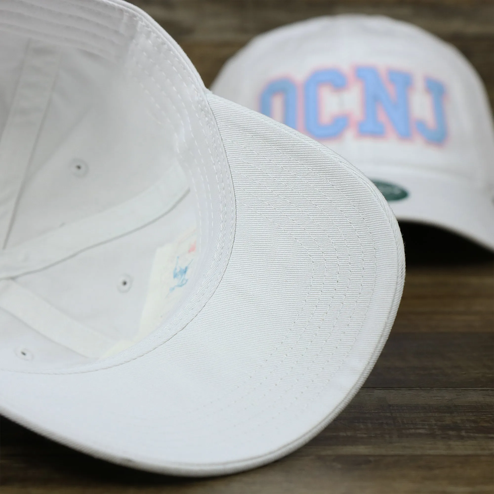 Light Blue OCNJ Wordmark Pink Outline Dad Hat | White Dad Hat