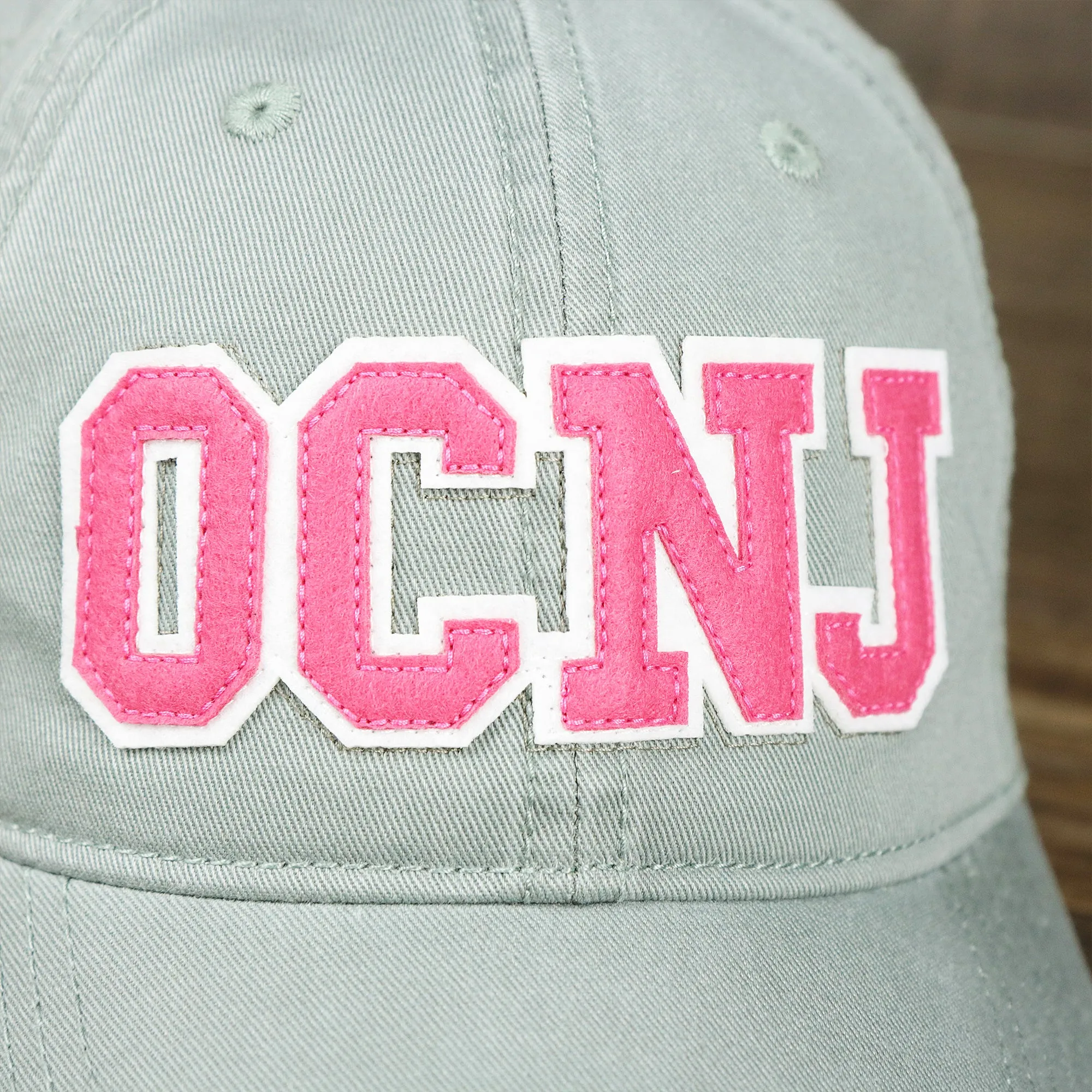 Pink OCNJ Wordmark White Outline Dad Hat | Sawgrass Dad Hat